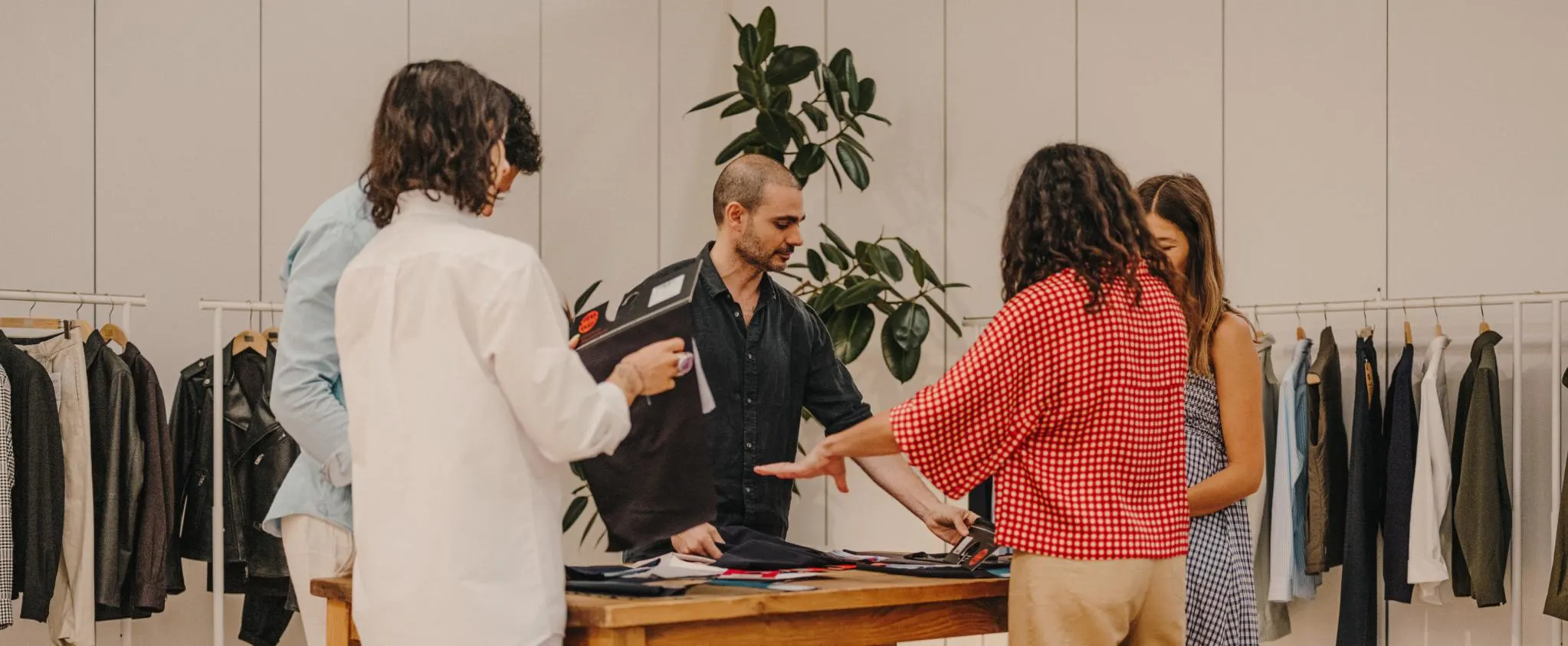 Contact UDAI - customer service team in a design studio.